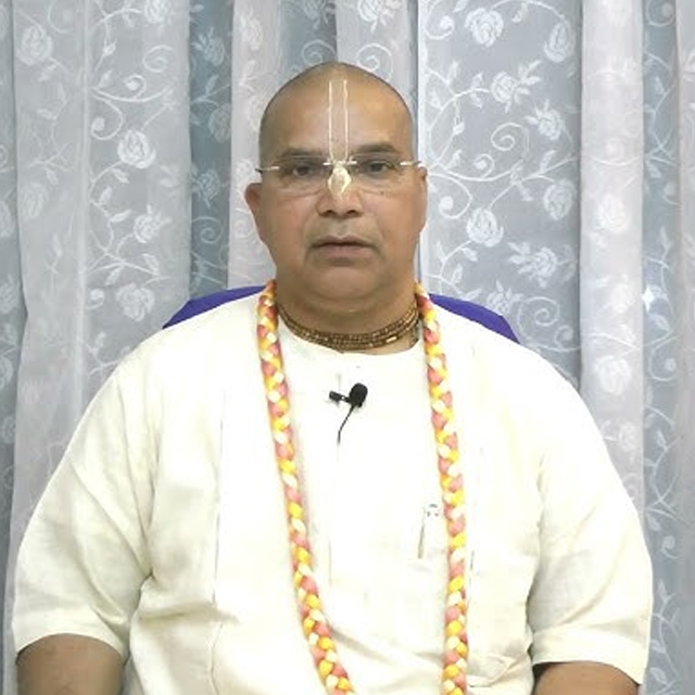 Devaki Nandana Dasa in devotional contemplation under a banyan tree